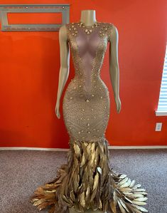 Golden Gal Rhinestone Feather Dress (Ready To Ship) - AMEKANA.COM Gold Fitted Pageant Party Dress, Gold Fitted Pageant Dress For Party, Rhinestone Dress For Prom Season And Glamorous Events, Rhinestone Dresses For Prom And Glamorous Events, Rhinestone Dress For Glamorous Events During Prom Season, Party Tulle Embellished Pageant Dress, Embellished Tulle Pageant Dress For Party, Champagne Rhinestone Evening Dress For Party, Champagne Evening Dress With Rhinestones For Party