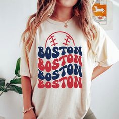 "Comfort Colors Boston Baseball Shirt, Boston Baseball Sweatshirt, Vintage Style Boston Baseball shirt, Boston Baseball fan Gift -Please check Color and Size Charts before placing the order. You can find them in the listing's photos (Depending on what device you are viewing this listing colors may vary slightly). -Returns and exchanges are accepted only if there are defects \"No Extra Costs\" We create custom t-shirts with great designs for everyone's liking. If you don't find the size or color you would like, please message us and we will be happy to  accommodate! Comfort Colors Boston Baseball Shirt, Boston Baseball Sweatshirt, Vintage Style Boston Baseball shirt, Boston Baseball fan Gift PRODUCT T-shirt Comfort Colors® 1717     Medium fabric (6.1 oz/yd² (206.8 g/m     Relaxed fit     Se Cotton Slogan T-shirt For Fan Gear, Sports Fan Long Sleeve T-shirt With Letter Print, Fan Merchandise Slogan Crew Neck Top, Long Sleeve Graphic T-shirt For Sports Fans, Crew Neck Slogan Top For Fan Merchandise, Baseball Season Graphic Print Tops For Fans, Baseball Season Tops With Graphic Print For Fans, Fan Apparel Slogan Crew Neck Top, White Sports Slogan Top