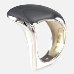 A Georg Jensen sterling silver modernist ring, originally designed by Allan Scharff for Hans Hansen. The ring is stamped with post 1945 Georg Jensen mark, '925 S', & the Hans Hansen makers mark. The ring is hallmarked with London import marks, 1999, and '925' to denote sterling silver. Period: - Late 20th Century. Engraving: - N/A. Maker: - Georg Jensen. Measurement: - UK ring size M (leading edge). US ring size 6 1/4 (leading edge). Weight: - 14.0 grams. Condition: - Minor surface scratches and Georg Jensen Ring, Gold Gate, Hans Hansen, Georg Jensen Silver, Memorial Ring, Modernist Ring, Gold Signet Ring, Watch Chain, Georg Jensen