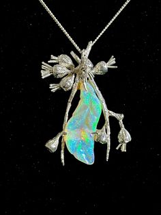 This beautiful Coober Crystal Opal is 15 CT's and has been set in a handcrafted sterling silver setting with sterling silver chain, to represent an Australian gum leaf.  It is truely a statement piece. Artisan Carved Sterling Silver Jewelry, Sterling Silver Carved Pendant Jewelry, Carved Sterling Silver Pendant Jewelry, Silver Nature-inspired Jewelry, Nature-inspired Carved Sterling Silver Jewelry, Iridescent Sterling Silver Spiritual Jewelry, Silver Nature-inspired Jewelry For Formal Occasions, Iridescent Unique Jewelry, Iridescent Sterling Silver Wedding Jewelry