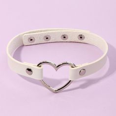 ~White Vegan Leather Silver Open Heart Choker Necklace ~11/2" Silver Open Heart Center Pendant ~17" White Adjustable Punk Gothic Choker ~Silver Snap Closures ~Also Available In Red, Pink, Rose Pink, Purple, Brown & Black ~General Cleaning Instructions: Wipe With A Damp Cloth, Dry With A Soft Cloth. Do Not Immerse In Water Or Jewelry Cleaner. ~Thank You For Your Interest In This Item! ~Please Shop All My Closet Items! ~Follow Me For Future Finds! Trendy White Metal Choker, Edgy White Jewelry For Gifts, Trendy White Heart-shaped Jewelry, Trendy White Jewelry For Valentine's Day, Ruby Heart Necklace, White Choker Necklace, Preppy Aesthetic Outfits, Y2k Heart, Girls Choker