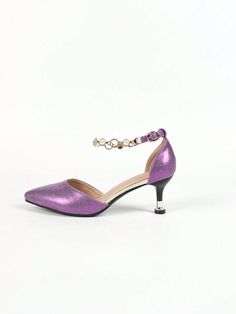 Experience luxury and elegance with our Elegant Black Gold Plated High Heel Shoes. Featuring a delicate pearl and diamond chain detail, these shoes will make a statement at any event. The gold plating adds a touch of sophistication, while the high heel provides a comfortable lift. Elevate your style with these stunning shoes. Color : Purple Style : Glamorous Toe : Point Toe Pattern Type : Graphic Details : Glitter, Pearls Strap Type : Ankle Strap Heel Height : Mid Heel Upper Material : PU Leathe Gold Chain Heels For Formal Occasions, Elegant Chain Heels For Party, Elegant Heels With Chain Strap For Party, Party Heels With Chain And Pointed Toe, Elegant Ankle Strap Heels With Chain, Party Heels With Chain And Round Toe, Gold Chain Heels For Party, Elegant Evening Heels With Chain Detail, Gold Heels With Chain For Party