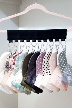 several pairs of socks hanging from a rack