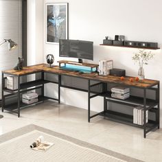 a computer desk with two shelves and a monitor on top of it in a living room