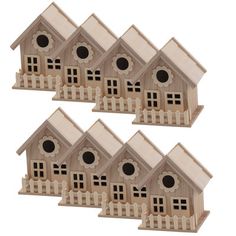 four wooden birdhouses with pickets and windows on each side, set against a white background