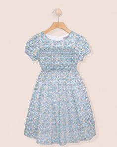 Demoiselle Liberty Carmella Daisy Blue Dress - Dress Fitted Smocked Dress With Ditsy Floral Print For Daywear, Blue Dress With Smocked Fitted Bodice, Short Sleeve Smock Floral Dress For Garden Party, Fitted Floral Dress With Smocked Bodice For Daywear, Fitted Smocked Dress With Smocked Cuffs For Garden Party, Blue Ruched Smocked Dress For Garden Party, Blue Smocked Dress For Garden Party, Blue Dress With Smocked Cuffs For Garden Party, Fitted Smock Dress For Garden Party