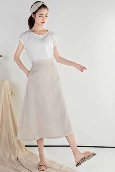 "DETAIL * 100% Linen * Back elastic * Two side pockets * A Line skirt * Below knee length skirt * Wash by hand or machine with cold water * The model is 170cm (5′ 7″) tall with a 66cm (26\") waist. She is wearing a XS/S in natural color. * Choose CUSTOM Order if you Need a better fit Can't find your size in our size Chart Change the Style Chang the Length Your Height is not Between 5'1\" - 5\"9\" SIZING AND FIT, Garment size as follow XS/S Waist 66-71cm Hips 100cm Length 75cm Weight suggest with Casual A-line Skirt With Elastic Waistband, Casual Midi Length Flowy Skirt, Casual A-line Maxi Skirt For Work, Solid Color Flowy Midi Skirt, Spring A-line Maxi Skirt With Pockets, Solid Color Midi Skirt For Summer, Summer A-line Maxi Skirt With Pockets, Spring Solid Color Midi Bottoms, Summer Solid Color Midi Skirt