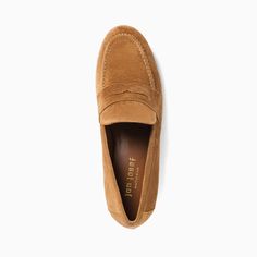 The Taylor is our new City-Style woman's loafer, sewn by hand in luxuriously soft suede. Its rubber sole is a key comfort feature. Go preppy-chic in this comfort-inpired tan penny loafer of impeccable fit, craftsmanship and quality. Split Suede upper Leather lining and insole Rubber sole .5 inch heel Made in Spain