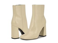 Nine West Spice - Women's Boots : Cream Patent : The Nine West Spice heels look stylish in appeal and effortlessly elevate your fashion statment. These come with a glossy leather upper, textile or man-made lining, and comfortable footbed. The heels are exquisitely crafted with a modern squared toe shape, side zipper closure for easy adjustability, and a high block heel. Ankle-length silhouette. Synthetic outsole. Imported. Measurements: Heel Height: 3 3 13 in Weight: 1 lb Circumference: 10 1 4 i Spring Trendy Patent Leather Heeled Boots, Trendy Spring Patent Leather Heeled Boots, Trendy Patent Leather Heeled Boots For Spring, Modern Polyurethane Boots For Fall, Spring Patent Leather Ankle Boots, Spring Ankle Boots In Patent Leather, Trendy Patent Leather Heeled Boots Medium Width, Modern Patent Leather Boots For Fall, Formal Cream Faux Leather Boots