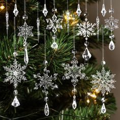 a christmas tree with snowflakes hanging from it