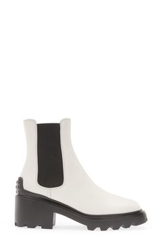 This elevated take on the Chelsea boot is distinguished by a block heel and lugged sole with pebbled tread inspired by the brand's driving shoes. 2 1/4" (57mm) heel (size 38.5) 6" shaft Pull-on style with elastic gore insets Leather and textile upper and lining/rubber sole Made in Italy Women's Designer Shoes Modern White Boots With Lug Sole, Workwear Boots With Lug Sole And Block Heel, Luxury Ankle Platform Boots With Lug Sole, Chic Calf Leather Platform Boots With Lug Sole, Modern Ankle Boots With Lug Sole, Calf Leather Platform Boots With Lug Sole For Work, Calf Leather Boots With Lug Sole For Work, Luxury Fall Platform Boots With Lug Sole, Modern Moto Boots With Lug Sole