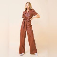 Vegan Leather Brown Leather Jumpsuit. Utility Style With Wide Legs. Never Worn. Trendy Brown Jumpsuits And Rompers With Pockets, Brown Short Sleeve Jumpsuits For Work, Brown Jumpsuits And Rompers For Fall, Trendy Belted Jumpsuits And Rompers For Fall, Trendy Belted Jumpsuit For Fall, Trendy Brown Jumpsuits And Rompers For Work, Trendy Brown Jumpsuits And Rompers For Spring, Brown Jumpsuits And Rompers For Work In Fall, Brown Jumpsuits And Rompers For Fall Workwear