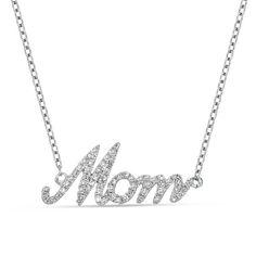 Simply shimmering, this diamond necklace is a look your mom can wear with anything. Created in cool 10K white gold, this elegant style showcases the word "Mom" sculpted in a cursive font and lined with sparkling diamonds. Captivating with 1/5 ct. t.w. of diamonds and a brilliant buffed luster, this word art suspends centered along an 18.0-inch cable chain that secures with a lobster claw clasp. Formal Silver Diamond Name Necklace, Mother's Day Silver Diamond Necklace, Silver Diamond Necklace For Mother's Day, White Gold Diamond Necklace Gift For Mom, Mother's Day Cubic Zirconia Diamond Necklace, Cubic Zirconia Diamond Necklace For Mother's Day, Anniversary Diamond Necklace For Mother's Day, Mother's Day Anniversary Diamond Necklace With Accents, Fine Jewelry Diamond Necklace For Anniversary, Mother's Day