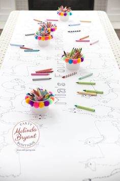 pencils and crayons are arranged on a table