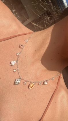 Mini Hawaiian Shell Charm Necklace ~ All shells found while diving on Oahu island! 16" sterling silver chain & has adorable glass bell flower beads in between shells. Great waterproof gift for the beach lover! Shop~ https://www.etsy.com/shop/NaniKaiDesignsHawaii?ref=shop-header-name&listing_id=1769517384&from_page=listing Beach Jewelry Aesthetic, Seashell Charm Necklace, Shell Charm Necklace, Surf Jewelry, Ocean Fashion, Beachy Jewelry, Seashell Jewelry, Seashell Necklace, Charm Necklace Silver