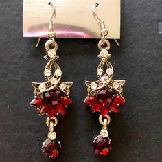 Brand New Earrings In Color Red With Diamonds Around It. You Can Wear These Earrings With A Simple Outfit For A Fancy Outfit It Would Look Good In Both. Party Ruby Earrings In Silver, Party Ruby Silver Earrings, Red Earrings For Christmas Formal Occasion, Red Earrings For Christmas Formal Events, Red Christmas Earrings For Formal Occasions, Red Crystal Metal Earrings For Parties, Red Crystal Metal Party Earrings, Red Metal Crystal Party Earrings, Nickel-free Red Drop Earrings Jewelry