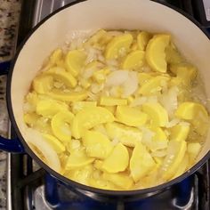 a pot filled with food sitting on top of a stove