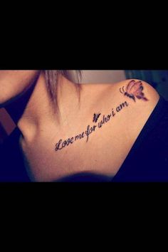 the back of a woman's neck with a tattoo saying love me for what i am