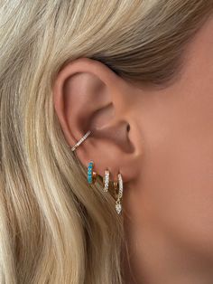 An everyday essential & best seller for a reason. This mini huggie earring is crafted with a row of sparkling pavé cz diamonds and accented with a single diamond teardrop that hangs delicately off the ear. Size: Inner Diameter 8mmStone: Cubic ZirconiaMaterials: Sterling Silver & 14K Gold Vermeil Turquoise Huggie Earrings, Huggie Earring, Stylish Earring, Genuine Turquoise