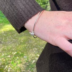 Our Elephant Charm Bangle is simplistic in design and beautiful for everyday wear. The sterling silver bee has exquisite detail in its body and wings and swings beautifully from the high shine bangle. The bangle has a lovely texture to it which catches the light as you move. Made from 100% Recycled Silver Bee measures approx. 12mm at its widest points Bangle diameter is 69mm Beautifully presented in a Reeves & Reeves box ready for gifting This bangle is perfect for stacking with others to create Elephant Charm, Recycled Silver, Charm Bangle, Highland Cow, In Design, Favorite Jewelry, Gift Set, Cow, Jewelry Bracelets