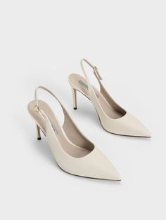 For classic pumps with an all-year appeal, these stilettos pumps in chalk-white are your best bet. Featuring the iconic stiletto silhouette and elegant pointed-toe, look put-together and polished the moment you slip these beauties on. The impressive 9.5cm heel lends any frame an instant style and height boost, while the adjustable slingback strap allows you to find your perfect fit. Pair them with palazzo pants and a tailored blouse for a chic, work-ready look. Charles And Keith Wedding Shoes, Shoes For Women Aesthetic Heels, Size 4 Heels, Stiletto Shoes Heels, Classic Pumps Heels, Classic White Heels, Cream Heels Outfit, Elegant Shoes Heels Classy