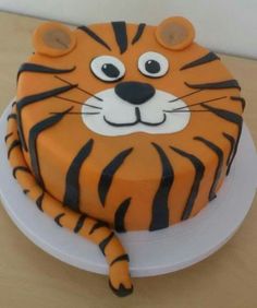 a tiger cake is sitting on a plate