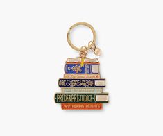 a stack of books keychain sitting on top of each other