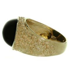 For Sale on 1stDibs - This classic estate men's ring features a large oval black onyx stone set in nugget-textured 14k yellow gold. Made in United States circa 1970s. Measurements: Black Onyx Stone, Men's Ring, Onyx Stone, Stone Settings, Black Onyx, Cuff Bracelets, Onyx, 1970s, Rings For Men