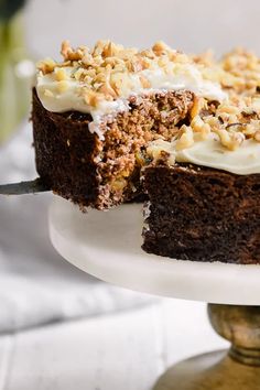 a close up of a cake on a plate with a slice taken out of it