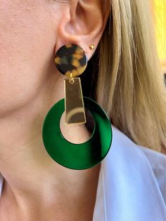 My latest creation is this handmade pair of Clip On Earrings that are made from plexiglass and they also have hypoallergenic metal clips. The upper side of the earrings is in animal print colors, there is a large hoop that seems like a tear drop at the down side in green color, and at the middle of the earring a gold bar connects them and create a really special pair of earrings. Different shapes and different colors create this really special pair of handmade earrings. They are lightweight and Modern Green Earrings As Gift, Modern Green Round Earrings, Modern Green Drop Earrings, Green Round Plug Earrings As Gift, Green Round Plug Earrings Gift, Modern Green Dangle Earrings, Unique Green Plug Earrings, Modern Green Nickel-free Earrings, Modern Nickel-free Green Earrings