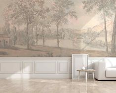 a living room with a white couch and wall mural