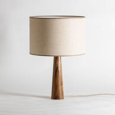 a wooden table lamp on a white background