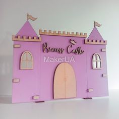 a pink castle with a bird on top and the words princess castle make - up above it