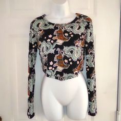 Cute Just Polly Long Sleeves Crop Top With Golden Chain Detail On The Sides. Size L New Without Tag Excellent Condition Pet Smoke Free Home Black Stretch Printed Tops, Stretch Black Printed Blouse, Black Printed Long Sleeve Tops, Black Stretch Printed Blouse, Printed Stretch Cropped Tops, Stretch Printed Crop Tops, Stretch Black Blouse With Graphic Print, Trendy Fitted Patterned Blouse, Black Printed Top For Fall