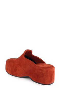 A center seam splits the streamlined silhouette of this contemporary-chic leather clog lofted on a chunky platform. 2 3/4" heel; 1 1/2" platform Water-resistant Leather upper and lining/rubber sole Made in Italy Suede Platform Slip-on Mules, Chic Platform Slippers With Sculpted Heel And Round Toe, Modern Platform Mules With Block Heel, Modern Mules With Leather Sole And Block Heel, Suede Platform Clogs With Wedge Heel, Suede Closed Toe Platform Clogs, Leather Clogs With Sculpted Block Heel, Chic Suede Platform Mules, Suede Platform Mules With Round Toe