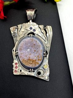 Artisan Gemstone Druzy Pendant Hand-made Sterling Silver. Stones used: Brazilian Druzy, Pink Tourmaline, Yellow Sapphire, Citrine,  Mystic Topaz. Height - 76mm, Width – 46mm.Unique Handcrafted One-of a-kind Design PendantEach Piece of Jewelry in my Collection is Absolutely One of a Kind!When you start wearing a piece of my jewelry you will fall in love with it more and more each day and feel that good Energy and Love that I pass into it while creating this piece of Art.A piece of Art created for Rough Gemstone Jewelry, Statement Rings Unique, Gift For Woman, Mystic Topaz, Rough Gemstone, Unique Gemstones, Good Energy, Agate Pendant, Yellow Sapphire