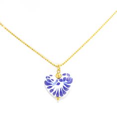 Embrace the artistry of Mexican craftsmanship with our Elegant Talavera Heart Pendant Necklace. This lovingly handcrafted piece features a stunning heart pendant, adorned with traditional cobalt blue and white Talavera designs, suspended from a delicate 19" beaded chain that gracefully complements its beauty. Each pendant is a work of art, shaped from clay and meticulously hand-painted, symbolizing the passion and dedication of the Mexican artisans who bring this jewelry to life. The 14k gold pl Blue Heart Charm Jewelry As Gift, Blue Heart Charm Jewelry Gift, Blue Heart Charm Jewelry For Gift, Blue Jewelry With Heart Charm For Gifting, Blue Heart Charm Jewelry As A Gift, Blue Heart Pendant Jewelry Gift For Her, Blue Heart Cut Jewelry For Gift, Personalized Blue Necklaces For Valentine's Day, Blue Personalized Necklace For Valentine's Day