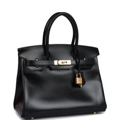 This Birkin is in Black boxcalf leather with gold hardware and has tonal stitching, front flap, two straps with center toggle closure, clochette with lock and two keys, and double rolled handles.The interior is lined with Black chevre and has one zip pocket with an Hermes engraved zipper pull and an open pocket on the opposite side.Collection: DOrigin: FranceCondition: Never worn (Plastic on hardware)Accompanied by: Hermes box, Hermes dustbag, clochette, lock, two keys, clochette dustbag, felt, ribbonMeasurements: 11.75" width x 9.5" height x 6" depth; 4.25" handle drop Evening Epsom Leather Bag With Lock, Evening Bags With Lock In Epsom Leather, Evening Bags With Turn-lock Closure In Epsom Leather, Evening Bags With Epsom Leather And Turn-lock Closure, Evening Bag In Epsom Leather With Metal Hardware, Luxury Leather Bag With Lock, Gold Epsom Leather Bag With Lock, Timeless Epsom Leather Bag With Metal Hardware, Leather Bags With Lock For Everyday Luxury