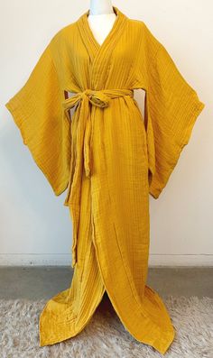 This dreamy handmade kimono style robe is insanely comfortable and effortlessly chic. The robe is voluminous and adjustable, with a long belt to tie the garment as tightly or loosely as desired. Traditional vents underneath the arms allow for extra aeration and room for the bust. The garment cam also be worn as a duster style jacket! The cotton double gauze fabric is lightweight yet warm, airy, and wonderfully soft.  Care: Machine wash gentle cold, Non-chlorine bleach, reshape, lay flat, cool iron Chartreuse Silk Robe, Belted Wrap Kimono For Loungewear, Spring Wrap Robe With Belt, Beach Kimono With Belted Kimono Sleeves, Chic Kimono With Tie Waist And Kimono Sleeves, Beach Kimono With Belt, Chic Wrap Kimono For Daywear, Bohemian Belted Kimono With Kimono Sleeves, Daywear Wrap Kimono With Tie Waist