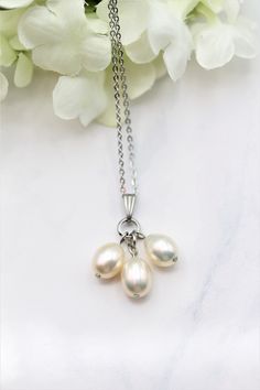 P181 Beautiful triple Pearls  Pearl are the symbol of New beginnings, June birthstone and 30th anniversary. Pearls are the most elegant and versatile accessory, they do not have to be reserved for special occasions anymore and can be a perfect jewelry for any attire. Specs: Pearl Type: Natural Freshwater  pearls  Pearl color: Super Iridescent gold with blue undertone Pearl Shape: Oval Pearl size: Approximately 9x7mm Pearl luster: Excellent, very reflective Source: Freshwater Chain style: Link Chain length: 16 inches  Metal: Stainless Steel (Tarnish Free) Professional settings and high-resolution cameras have been used to photograph this incredible jewelry, colors may vary from monitor to monitor. If this purchase is a gift and is going directly to the recipient, we can gift box it and send Future Jewelry, Gifts For Anniversary, Past Present Future, June Birthstone, Pearl Types, Simple Gifts, Delicate Jewelry, 30th Anniversary, June Birth Stone