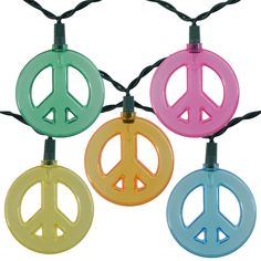 four peace signs are hanging from string lights on a white background with black cord and green, yellow, pink, blue, and orange colors