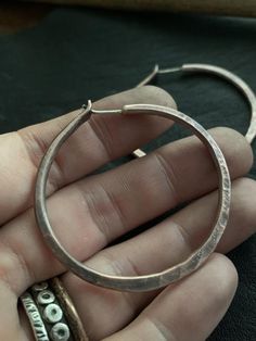 These hoops are PERFECTLY rustic like a set of modern day artifacts.  They compliment an style, be it BOHO, minimalist or professional.  These aren't commonplace prefab hoops because each one is crafted by hand with love but they WILL be your new favorite for everyday wear! They're thick and substantial yet still comfortable.  Please read below concerning sizing. Custom sizes upon request. All jewelry from my studio is endowed with a lifetime craftsmanship guarantee & will arrive attractivel Adjustable Soldered Hoop Earrings For Gifts, Handmade Copper Round Hoop Earrings, Electroformed Metal Hoop Earrings, Gift Hoop Earrings With Soldered Metal, Handmade Copper Silver Hoop Earrings, Handmade Copper Hoop Earrings, Bronze Round Hoop Earrings For Gift, Vintage Bronze Hoop Earrings, Bronze Adjustable Hoop Earrings Gift