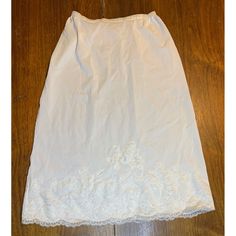 Vintage Artemis Size 26 skirt slip looks new! Beautiful lace and elastic is in perfect condition! No stains or wear. No snags or tears on lace. 23" long 10 1/2" no stretch waist, stretching to 16" Features: * White * Size 26 * Vintage lace * 23" * Waist 10" to 16" * Skirt slip Size: Womens 26 Condition: Pre-Owned Like New Excellent condition Fitted Lace Bottoms For Daywear, Stretch Lace Trim Skirt, Daywear Lace Lined Skirt, Lace Lined Skirt For Daywear, Lace Flowy Skirt For Daywear, Flowy Lace Skirt For Daywear, Skirted Stretch Bottoms With Lace Trim, Stretch Long Skirt For Daywear, Vintage Style Stretch Bottoms With Lace Trim