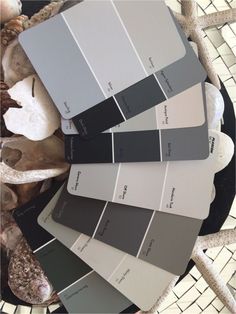 several shades of gray and white on a table