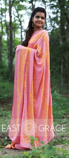 Featuring a coral pure georgette saree from EAST & GRACE with orange gingko leaf rows on pallu and skirt of the saree. It comes with an unstitched orange sleeveless blouse. Visit www.eastandgrace.com. Price: RS.13,000. Saree Style, Designer Blouse, Cotton Fabrics