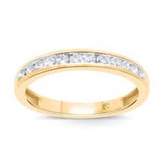 a yellow gold wedding ring with princess cut diamonds on the side and channel set in the middle