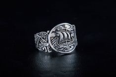 * Viking Longship Ring with Wolf Ornament * ★ SIZE and WEIGHT ★ This ring can be made almost in any size you need, just check options. Weight - 9-10 grams approximately This ring (and all our other jewelry) we make to order only, so it means that you will receive the item, which will be made especially for you! This ring made of 925 silver with dark grey (or light black) patina. If you need it without patina - just silver - please send me a direct request. This ring comes with a beautiful brande Viking Style Engraved Ring Jewelry, Viking Style Engraved Ring, Handmade Viking Style Ring Jewelry, Viking Style Sterling Silver Ring, Viking Style Adjustable Jewelry Ring, Adjustable Viking Ring Jewelry, Adjustable Viking Jewelry Ring, Adjustable Viking Style Ring Jewelry, Handmade Viking Ring As A Gift