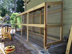 the back porch is being built and ready to be used as a screened patio area