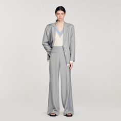 High-waisted flared trousers Chic Wide-leg Pants Suits For Office, Tailored Wide Leg Pants With Pockets For Office, Fall Pantsuit With Pressed Crease Trousers, Wide Leg Pants With Welt Pockets For Office, Workwear Wide Leg Pants With Welt Pockets, Fall Office Wide Leg Pantsuit, Wide Leg Fall Pantsuit For Office, Straight Pantsuit With Pressed Crease For Fall, Fall Pantsuit With Pressed Crease And Straight Pants