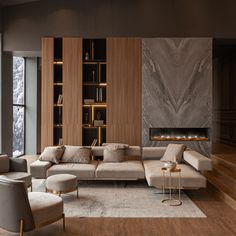 a living room with a couch, chair and fire place in the fireplace on the wall